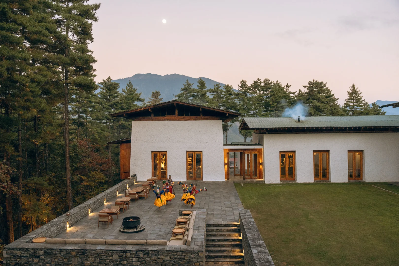 The courtyard terrace of Amankora's Thimphu Lodge among pines
